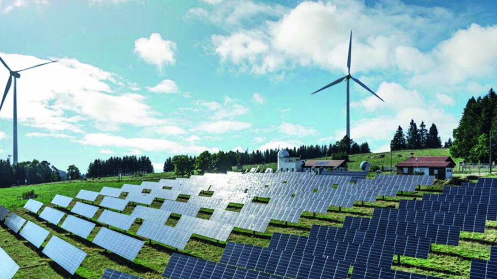 Parc éolien et centrale solaire illustrant la transition énergétique en France.